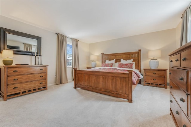 bedroom featuring light colored carpet