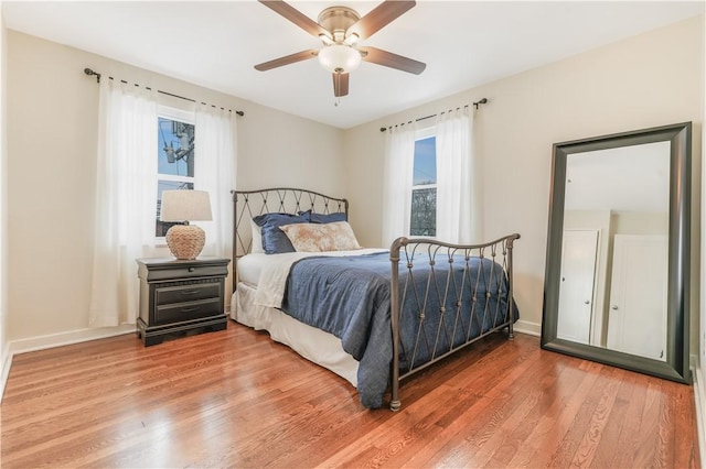 bedroom featuring hardwood / wood-style floors and ceiling fan