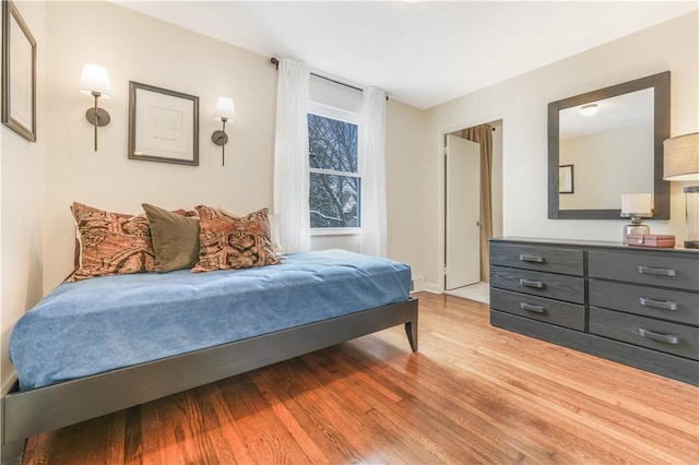 bedroom with light wood-type flooring