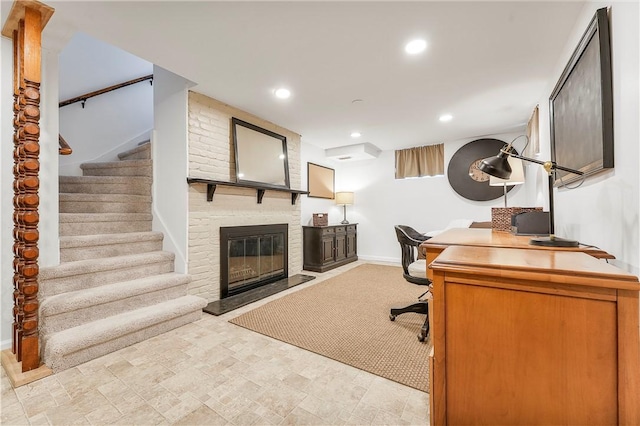 office space featuring a brick fireplace