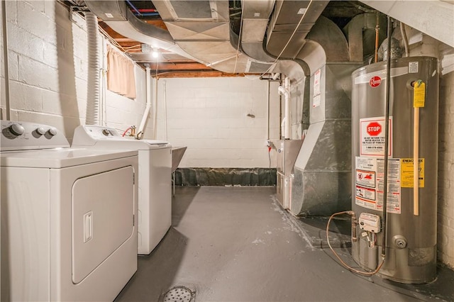 basement with separate washer and dryer, heating unit, and water heater