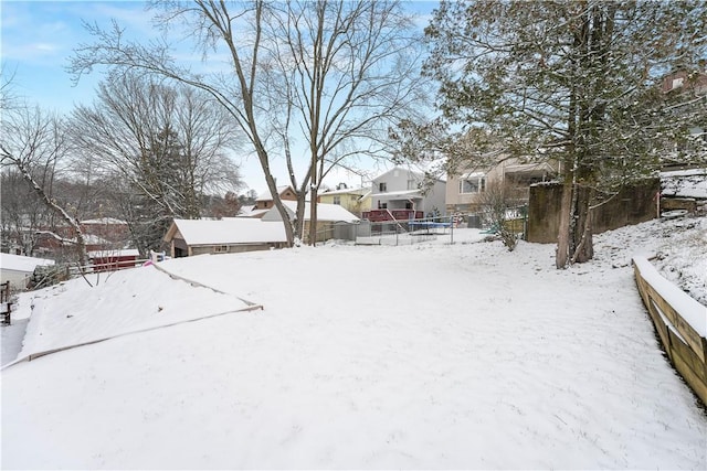 view of yard layered in snow