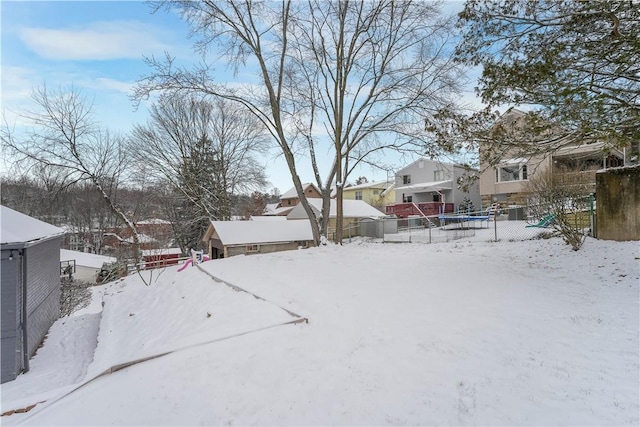 view of yard layered in snow