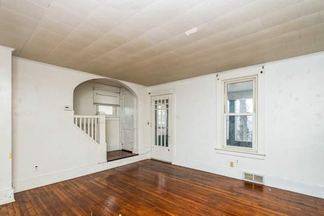 spare room featuring dark hardwood / wood-style flooring