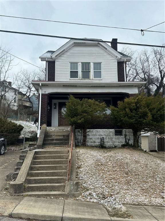 view of front of property featuring covered porch