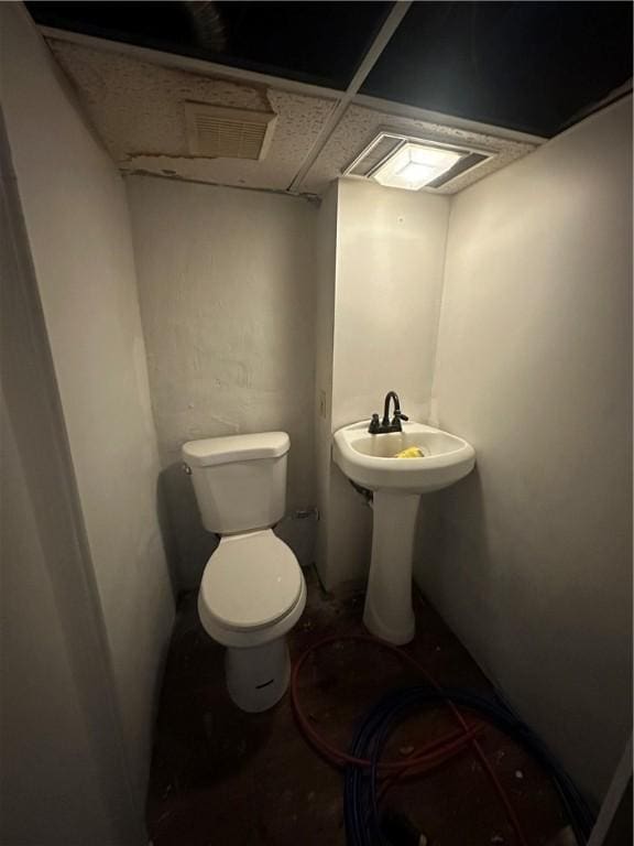 bathroom featuring toilet