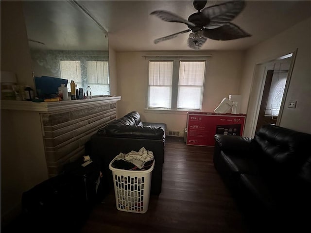 interior space featuring ceiling fan and dark wood-type flooring