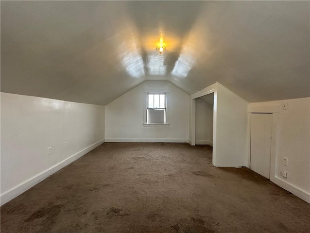 bonus room featuring carpet and lofted ceiling