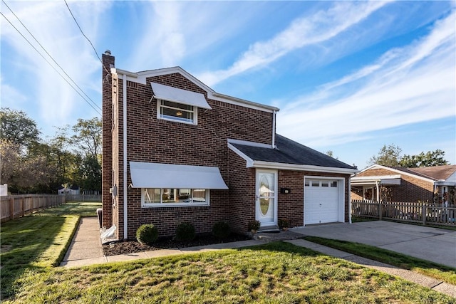 view of front of house with a garage and a front lawn