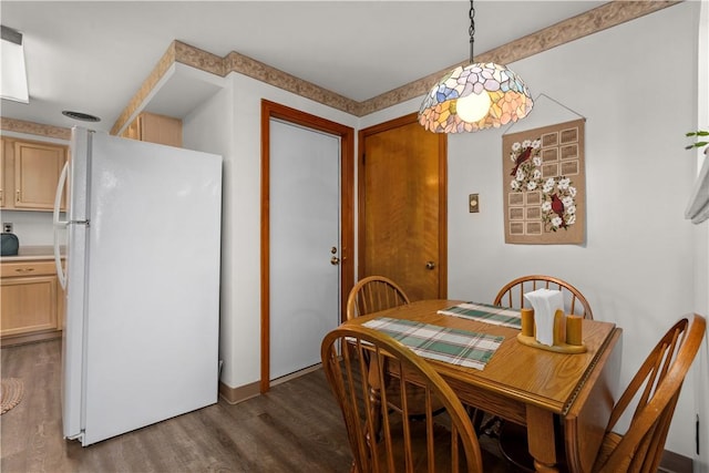 dining area featuring dark hardwood / wood-style floors