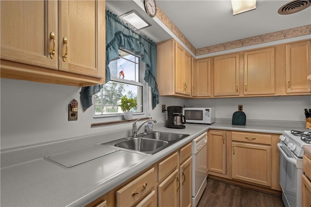 kitchen featuring light brown cabinetry, white appliances, dark hardwood / wood-style floors, and sink