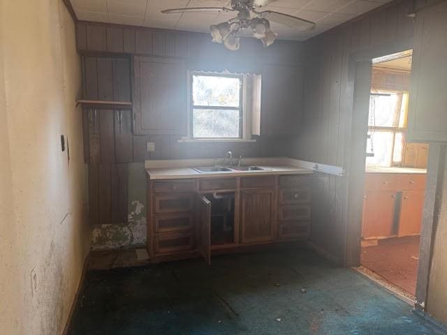 kitchen with ceiling fan and sink