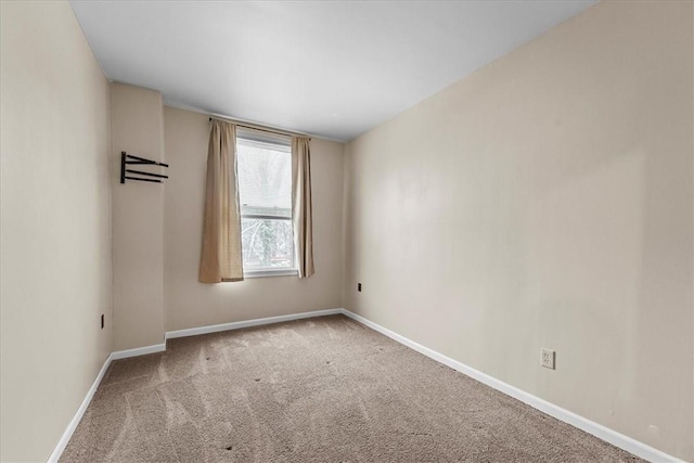 unfurnished room with carpet flooring