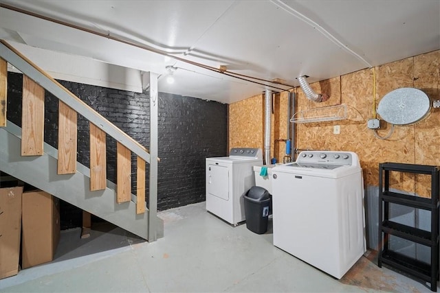 basement with sink and washer and dryer