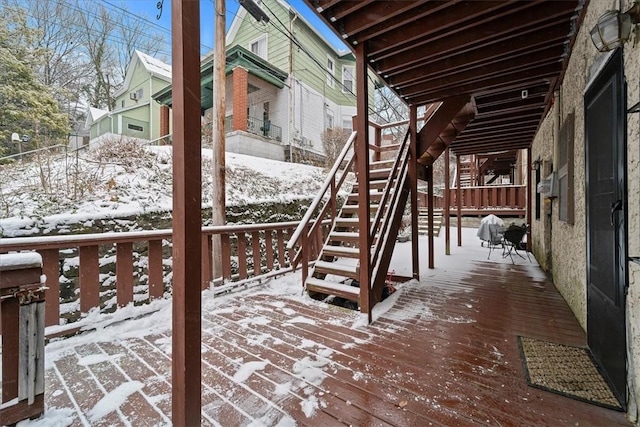 view of snow covered deck