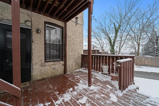 view of snow covered deck