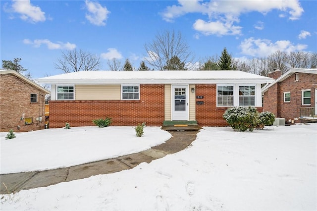 ranch-style house with central air condition unit