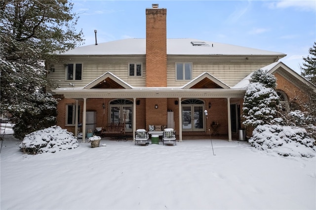 view of snow covered house