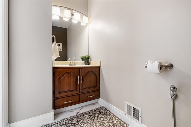 bathroom with tile patterned floors and vanity