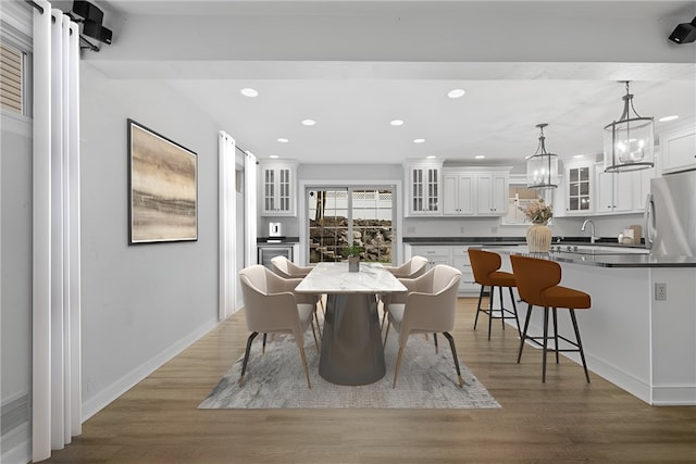 dining area with hardwood / wood-style flooring