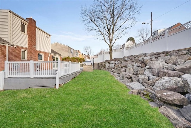 view of yard with a deck