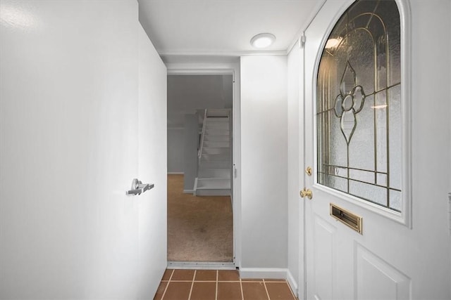 corridor featuring dark tile patterned floors