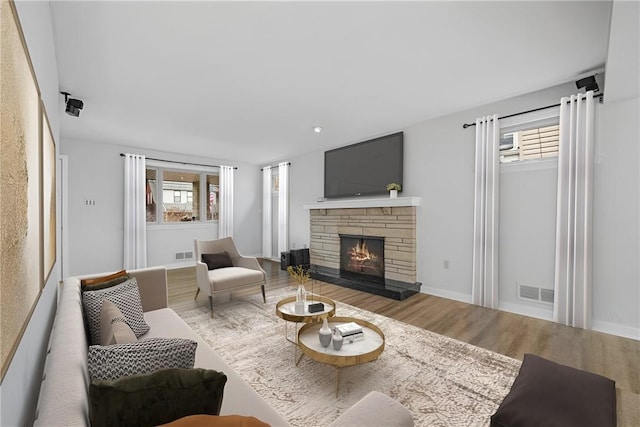 living room featuring hardwood / wood-style floors and a fireplace