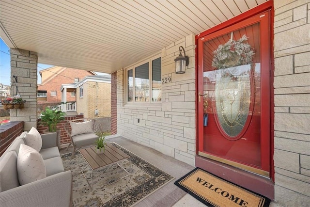 view of exterior entry featuring a porch