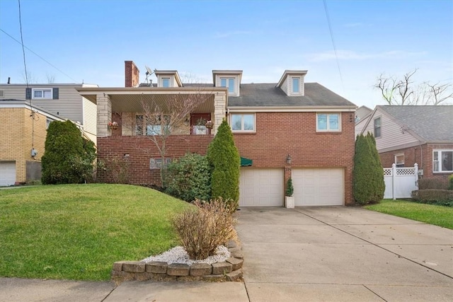 view of front facade with a garage and a front lawn