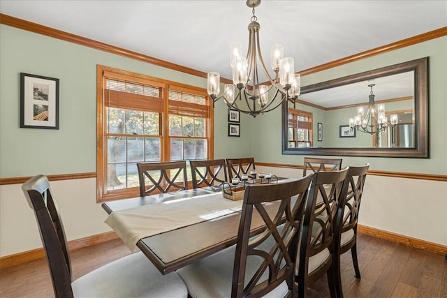 dining room with a chandelier, hardwood / wood-style floors, and ornamental molding