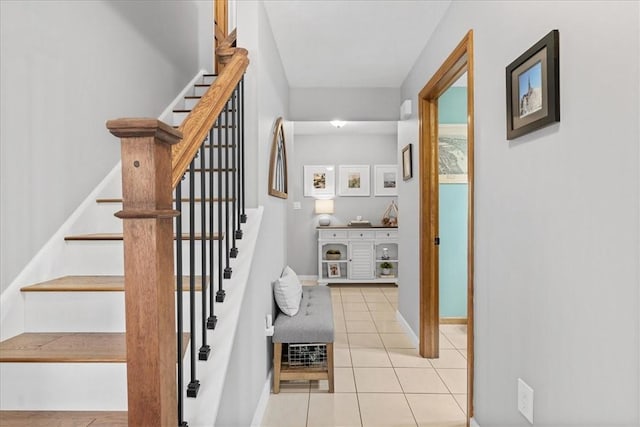 stairway featuring tile patterned floors