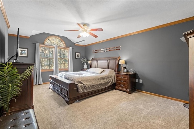 bedroom with ceiling fan, crown molding, light carpet, and lofted ceiling