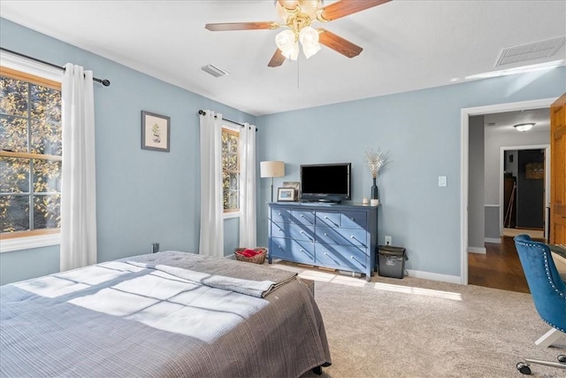 bedroom with ceiling fan and carpet