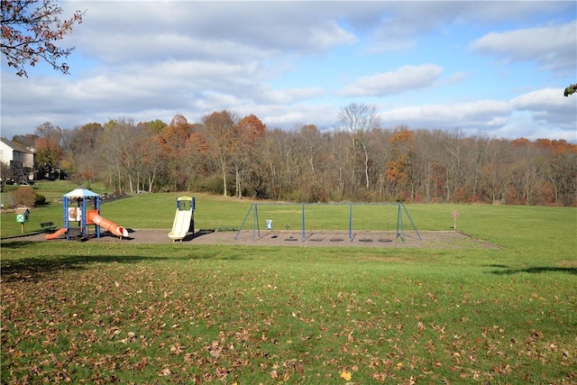 view of community with a playground and a yard