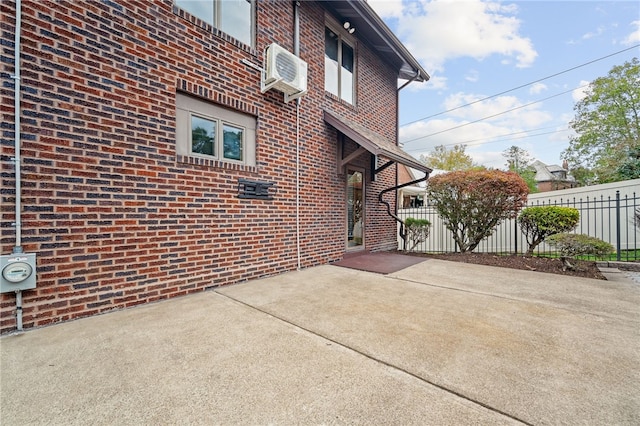 view of patio / terrace featuring a wall mounted air conditioner