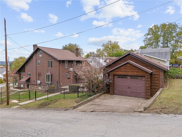 view of front of property with an outdoor structure and a garage