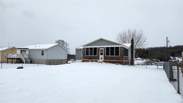 view of snow covered house