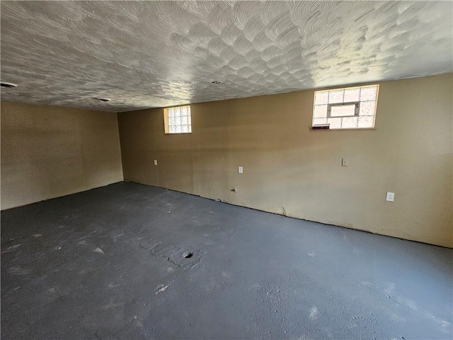 basement featuring a textured ceiling