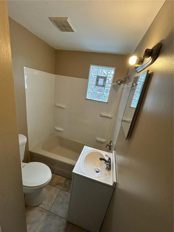 full bathroom with shower / bathing tub combination, vanity, toilet, and tile patterned floors