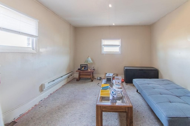 sitting room featuring a baseboard heating unit