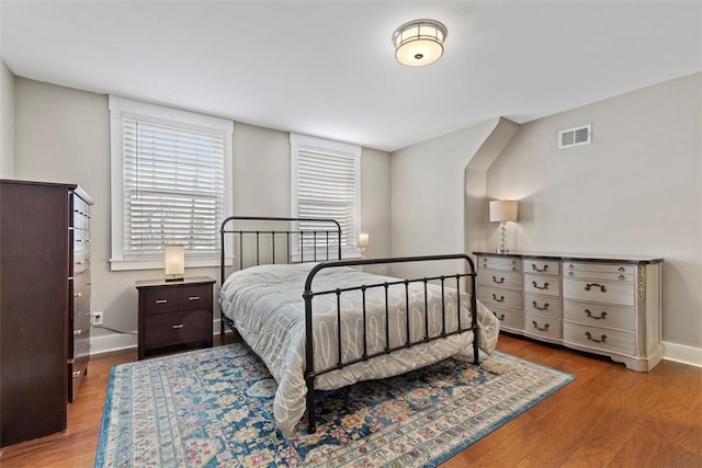 bedroom featuring wood-type flooring