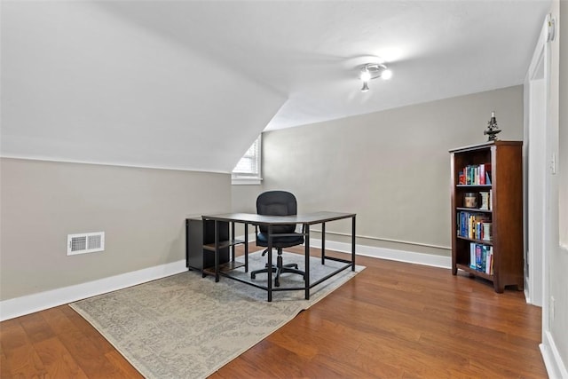 office area featuring wood-type flooring and lofted ceiling