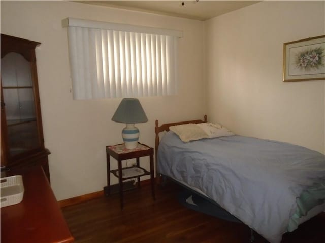 bedroom featuring dark wood-type flooring