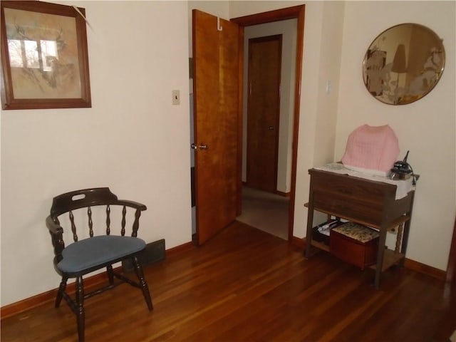 sitting room featuring dark hardwood / wood-style flooring