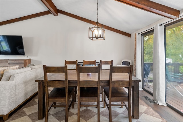 dining room with vaulted ceiling with beams, light hardwood / wood-style flooring, and a chandelier