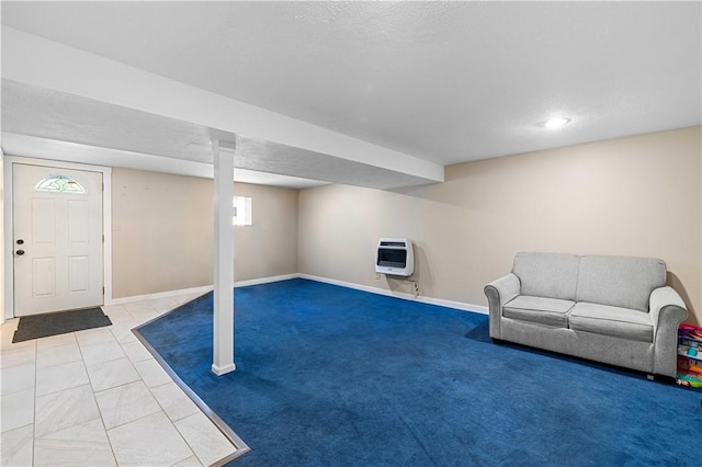 basement with tile patterned floors and heating unit