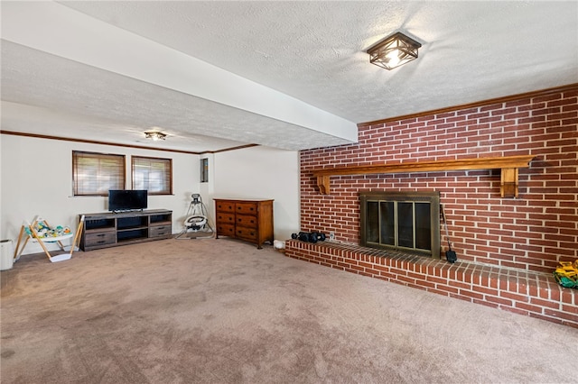 living room with carpet flooring, a textured ceiling, and a brick fireplace