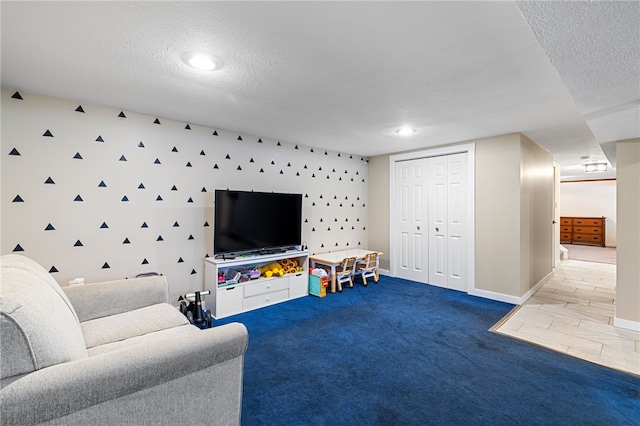 carpeted living room with a textured ceiling