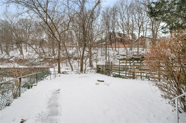 view of yard layered in snow