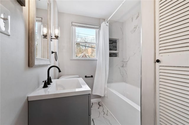 bathroom with marble finish floor, shower / bath combo, and vanity